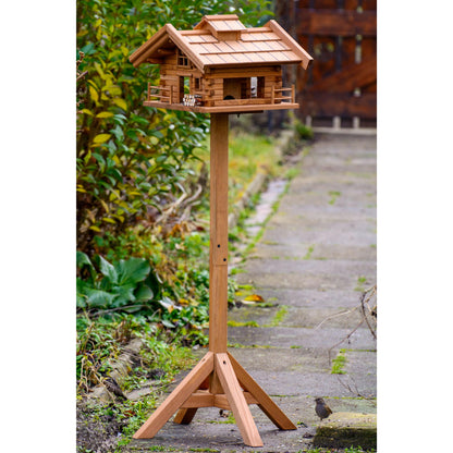 LUXUS-VOGELHAUS® Vogelfutterhaus "Tirol" aus wetterfest lasiertem FSC®-Kiefernholz mit Vierbein-Ständer.
