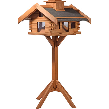 Detailansicht der Vogelvilla im rustikalen Berghütten-Design mit Futterpyramide für gleichmäßige Futterverteilung.
