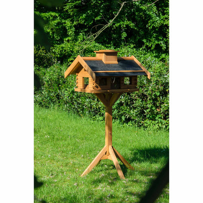 Vogelhaus mit abnehmbarer Schornsteinspitze zum einfachen Befüllen des Futtersilos und dekorativem Design.
