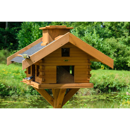 LUXUS-VOGELHAUS® Futterstation mit stabilem Standfuß und wetterfester Lasur, ideal für den Garten oder die Terrasse.
